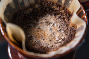 Closeup grinded coffee in dripper cup